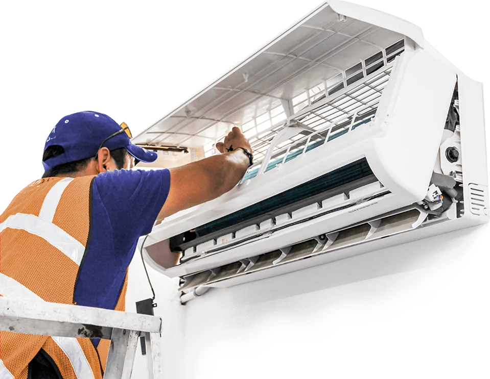 Zahid Brothers technician servicing a wall-mounted AC in Lahore